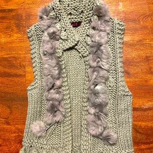 Grey knit vest.